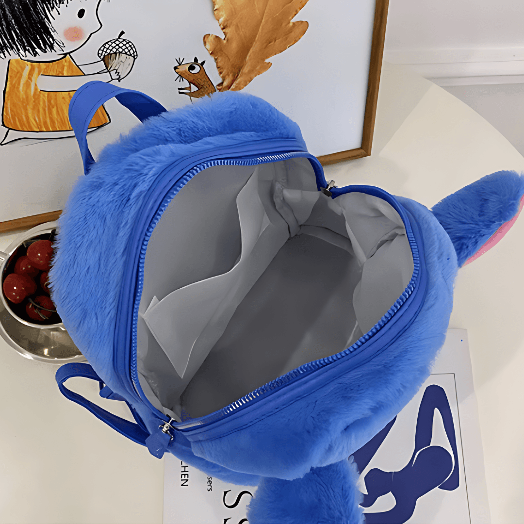 plush blue Cartoon Backpack with an open zipper is displayed, revealing an empty interior. The backpack has a soft, fuzzy texture