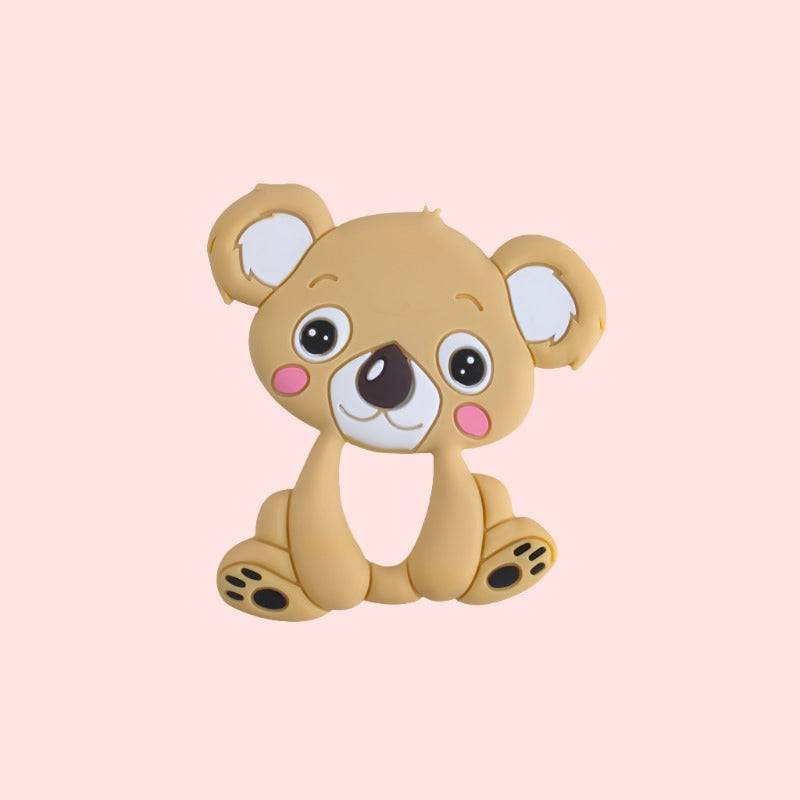 cute cartoon koala teether, with large eyes and friendly expression The koala has tan fur with darker patches around the eyes, inner ears, and limbs. It features a prominent black nose and rosy cheeks, perfect for children’s educational materials about wildlife or Australian animals