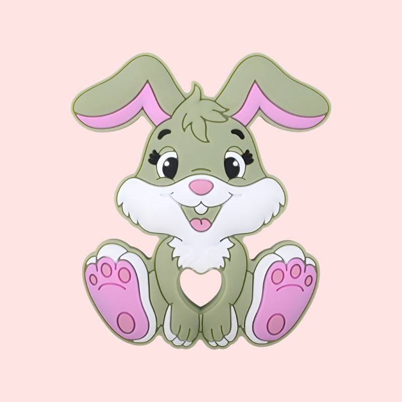 cute green cartoon teether bunny with large pink ears and feet sitting against a soft pink background, the bunny has expressive eyes, a friendly smile, and its paws are gently resting on its tummy, friendly bunny illustration, children’s character design, Easter-themed bunny, adorable bunny image, cartoon bunny with expressive eyes, pink background bunny