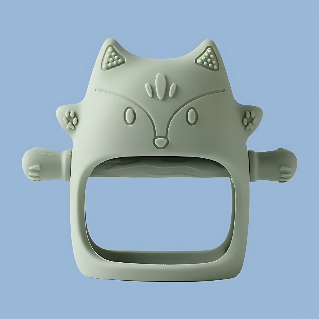 A fern-colored, cat-shaped silicone baby teether, features embossed ears, eyes, nose, mouth, and whisker details, cat-shaped silicone, embossed design, silicone teether