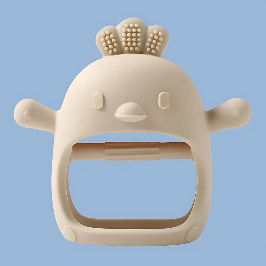 cream baby teether in the shape of a cartoon baby chicken, designed for soothing infants’ gums, baby teether, cartoon lion teether, infant soothing toy, teething relief, soft silicone teether, baby gum soother, teething toy for babies, this toy is perfect for soothing your baby’s sore gums while providing a fun and engaging design  