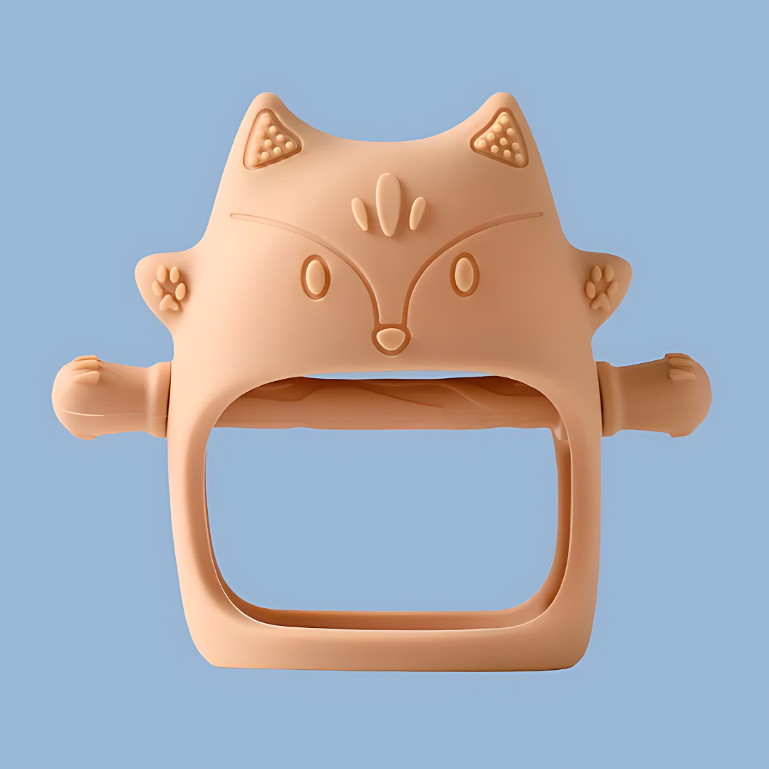 A peach-colored, cat-shaped silicone baby teether, features embossed ears, eyes, nose, mouth, and whisker details, cat-shaped silicone, embossed design, silicone teether