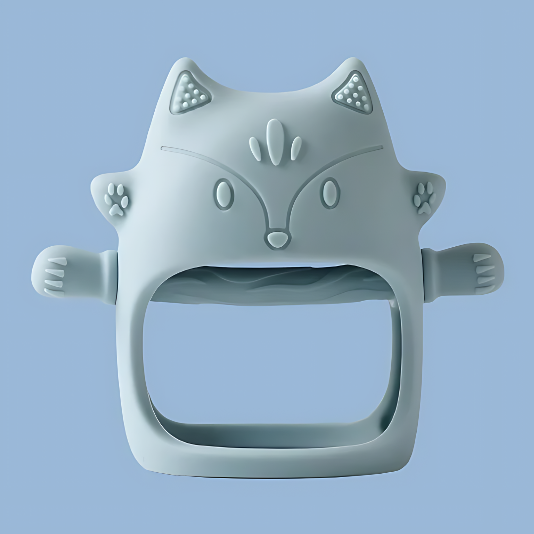 A blue-colored, cat-shaped silicone baby teether, features embossed ears, eyes, nose, mouth, and whisker details, cat-shaped silicone, embossed design, silicone teether